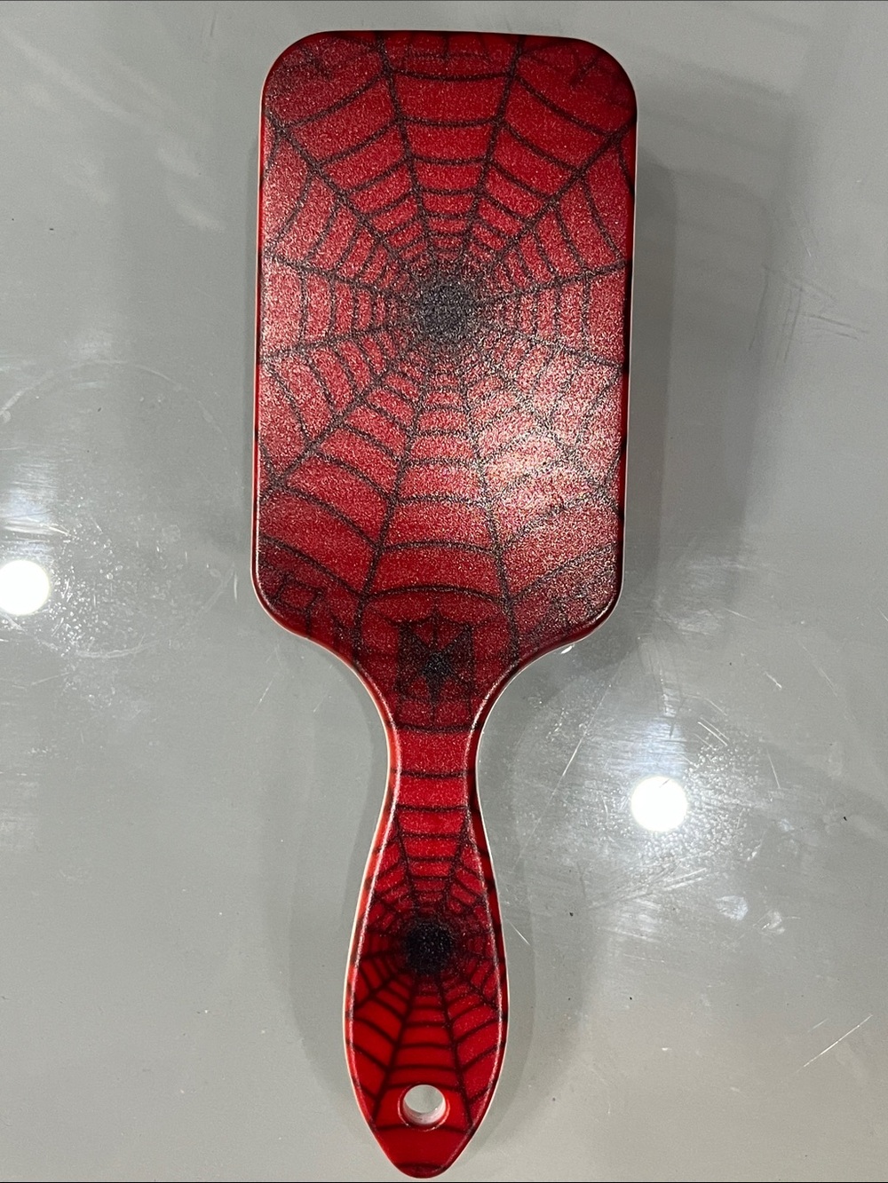 Red Spiderweb Paddle Brush - Home Accents